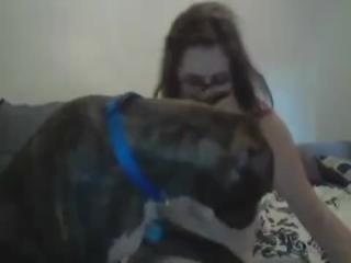 This video shows a cute girl getting licked by a dog. Please choose a category for animal sex, very beautiful zoo sex movies